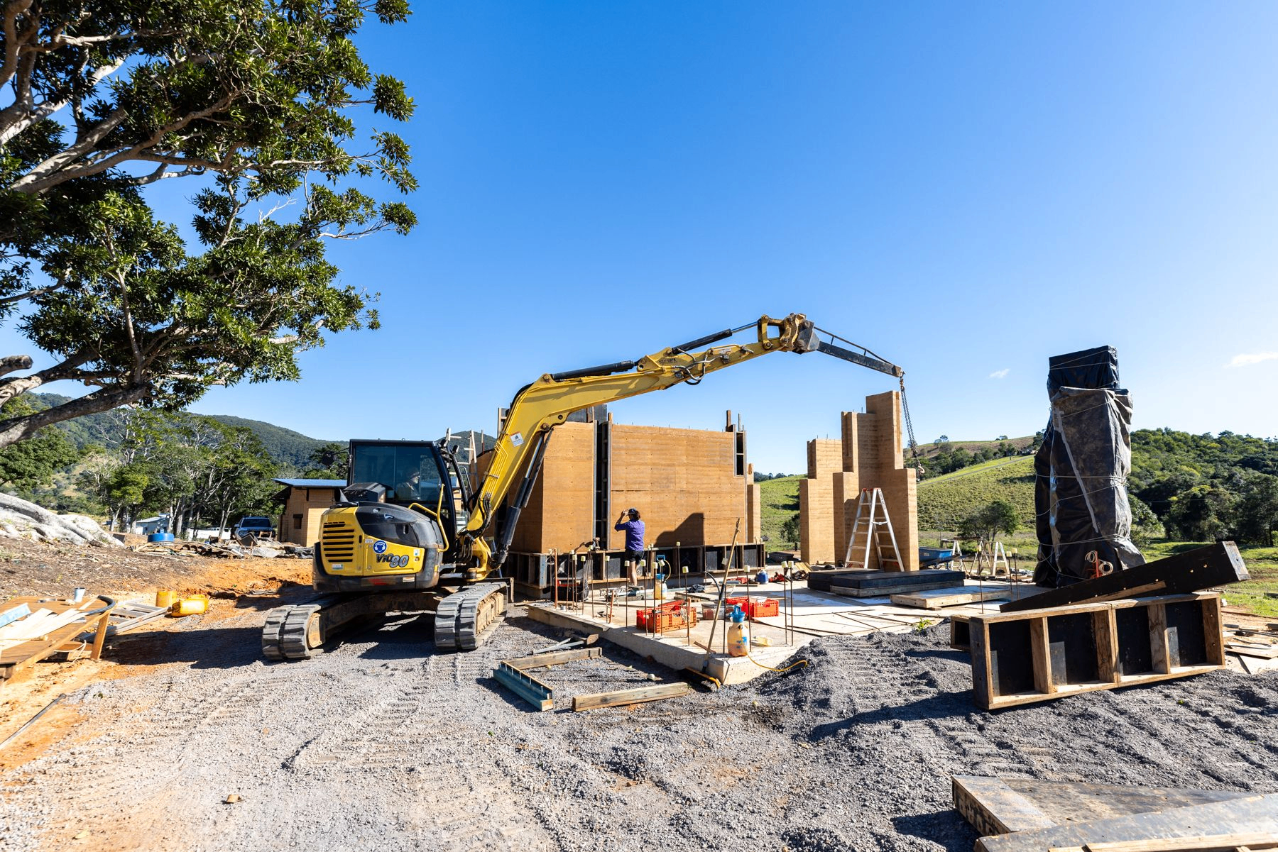 A rammed-earth wall under construction at Mayan Farm