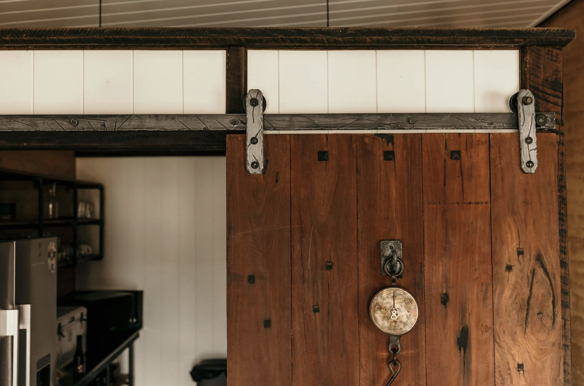 Sliding barn door with vintage hanging scale